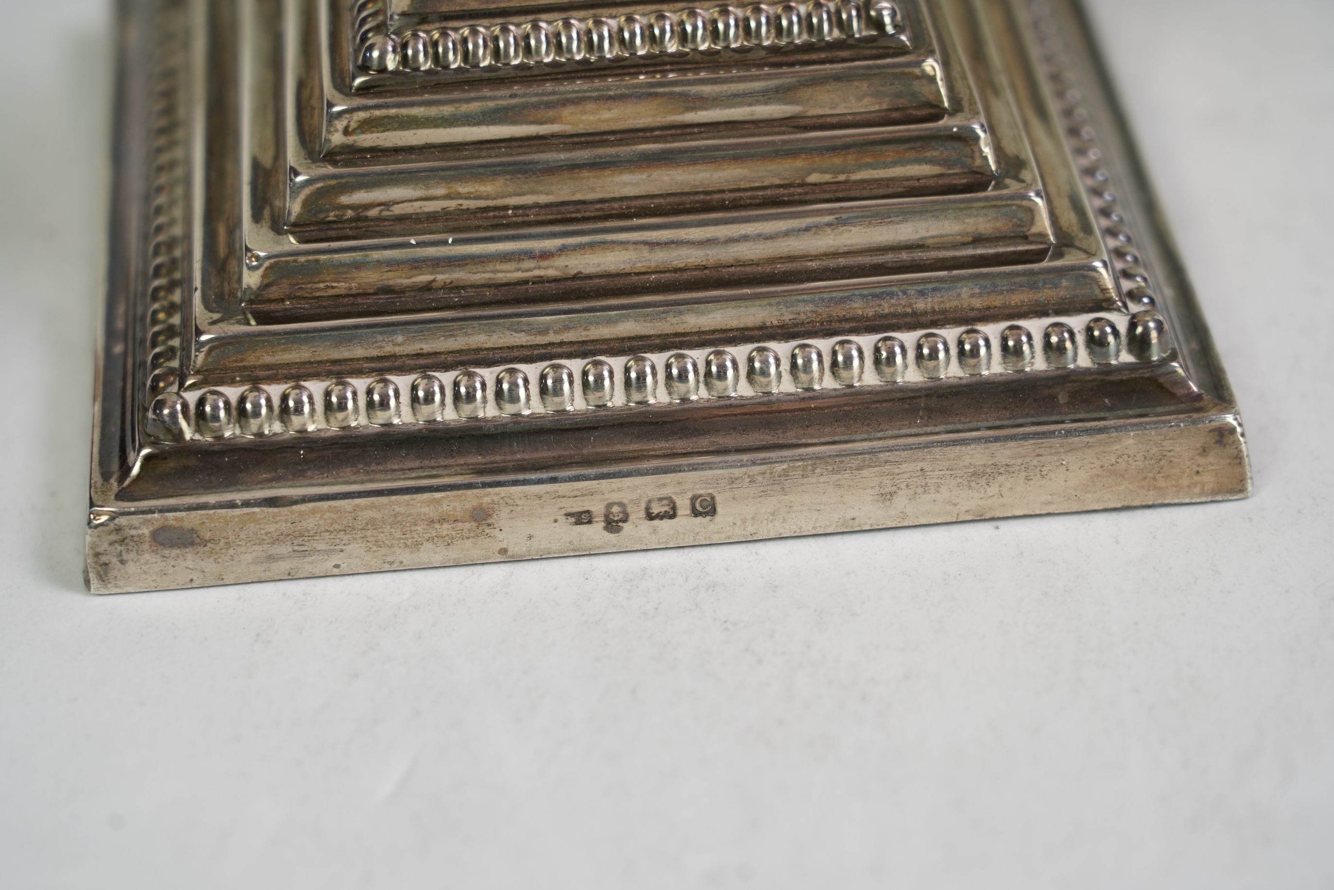 A pair of George V silver candlesticks, maker N.S.